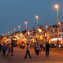A promenade scene shows a busy Blackpool seafront
