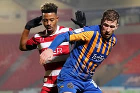 Josh Vela (right) in action for Shrewsbury Town last season against Doncaster Rovers
