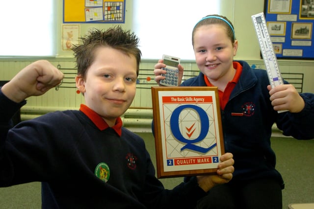 Pupils Jessica Baron (10) and Kieran Wilkinson (10) celebrate after St John's CE Primary School in Blackpool received a Quality Mark from the Basic Skills Agency