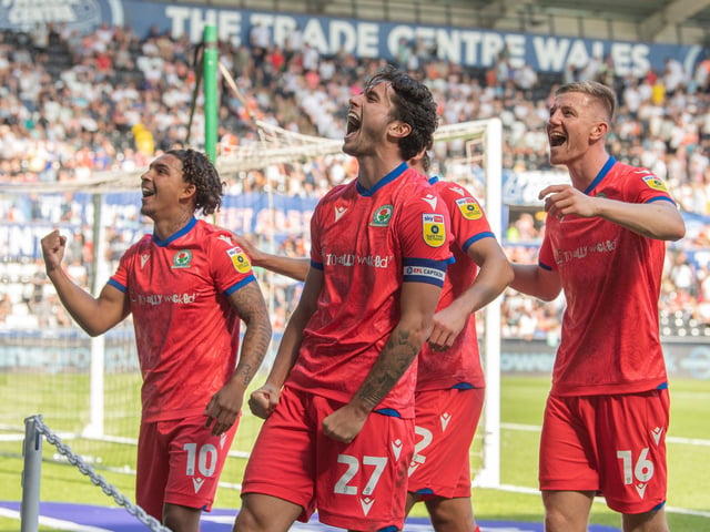 Blackburn Rovers' Lewis Travis (centre) celebrates scoring his side's third goal with team-mates

The EFL Sky Bet Championship - Swansea City v Blackburn Rovers - Saturday 6th August 2022 - Liberty Stadium - Swansea