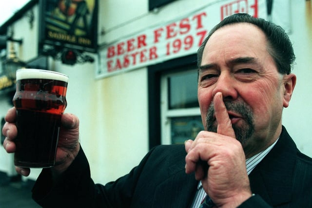 Licensee Don Ashton from the Saddle on Whitegate Drive ahead of the pub's Beer Festival in 1997. The had received numerous complaints about the noise in the previous year and as a result were having a mime artist as part of the entertainment