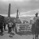 Mounted police lead a demonstration in support of a proposed 4.26 pound per hour minimum wage during the Trades Union Congress conference