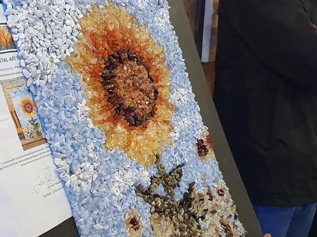 Original artwork of a sunflower made out of crystals by artist Paul Wright. Sold for £80.