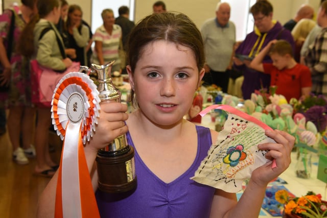 Erin Jones celebrates winning the eight- to-11-year-old children's honours at Freckleton Horticultural Show. Picture: Neil Cross.