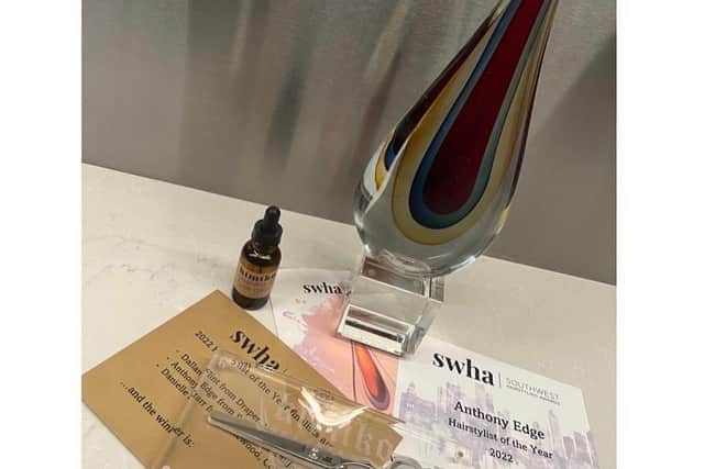 The stylish glass plaque won by Anthony Edge for the South West Hairdressing Awards in America