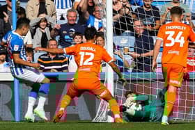 The ball crossed the line despite Dan Grimshaw's best efforts, but the goal didn't stand