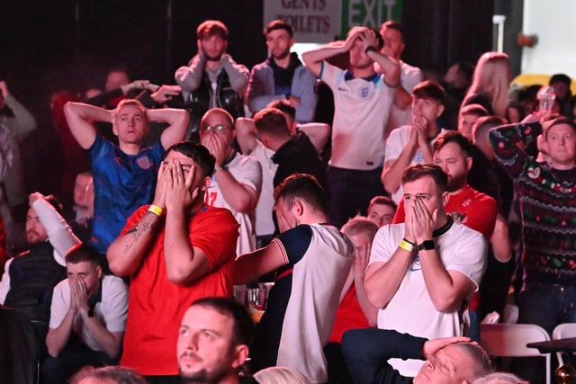 Fans at Winter Gardens, Blackpool, reacting to the missed penalty by Harry Kane as they watch a screening of the FIFA World Cup 2022 Quarter Final match between England and France
