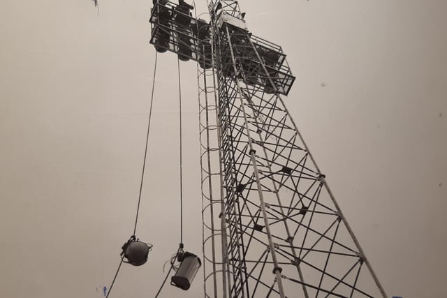 The caption on the back of this photo from December 1973 reads 'Like a scene from Aladdin, it was a case of new lamps for old at Blackpool FC. The old floodlights were being replaced by three and a half kilowatt mercury, halogen band floodlighting, which will only need 10 lamps per tower for improved lighting'