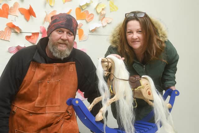 Ex-serviceman Kev Gray, who made a wooden rocking horse  to help raise funds for special memorial garden at Larkholme Primary School in Fleetwood, says there are too many negative stereotypes about veterans with PTSD.  He is pictured with wife Gillian Gray