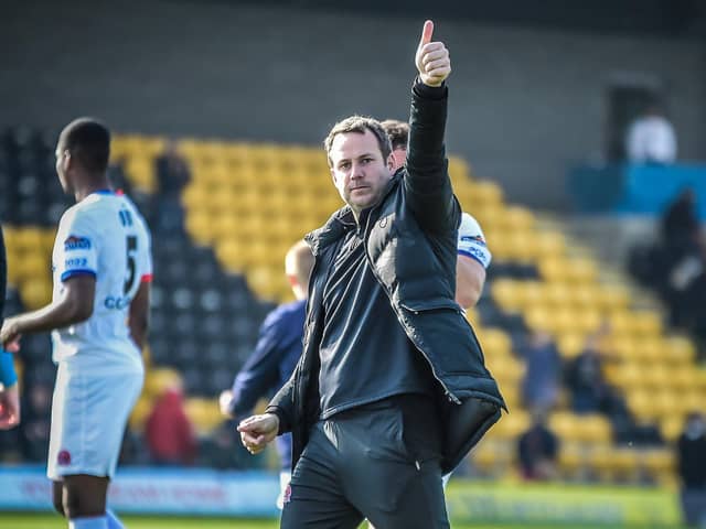 AFC Fylde manager James Rowe gives the 3-1 victory at Boston United a big thumbs-up Picture: STEVE MCLELLAN
