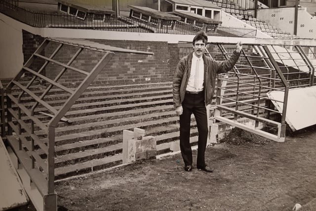 Mr Morris at the new emergency gates which opened Bloomfield Road's South paddock on to the ground
