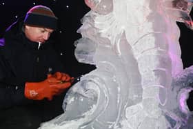 Mathew Chaloner, chief sculptor at Glacial Art, demonstrates on stage at the Fylde Ice Festival 2025.