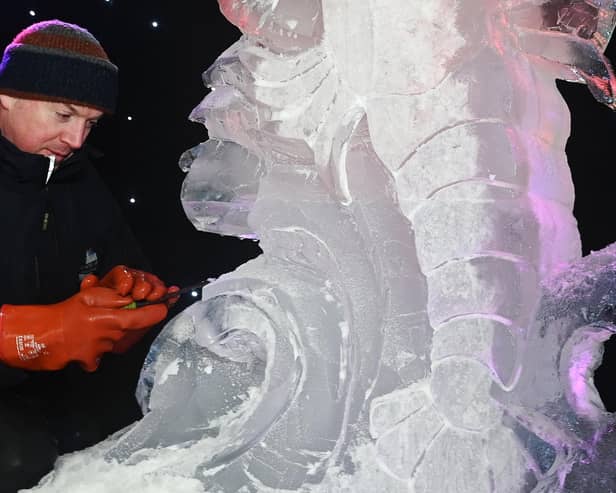 Mathew Chaloner, chief sculptor at Glacial Art, demonstrates on stage at the Fylde Ice Festival 2025.