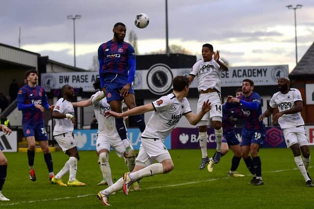 AFC Fylde defender Sam Graham rises highest during their defeat at Boreham Wood Picture: Steve McLellan