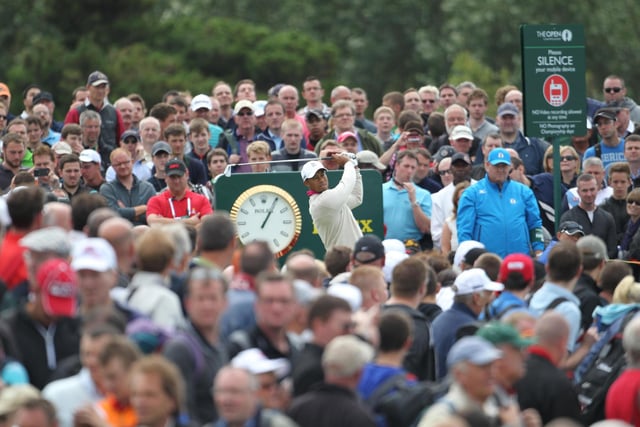 A packed gallery of fans look on as Tiger Woods tees off on day one of the 2012 Open Championship at Royal Lytham and St Annes Golf Club