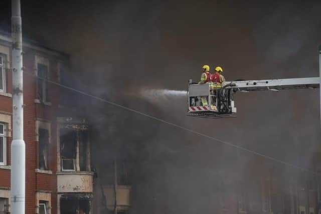 Firefighters use one of two aerial ladder platforms to tackle the blaze at the derelict New Hacketts Hotel in Queen's Promenade, Blackpool