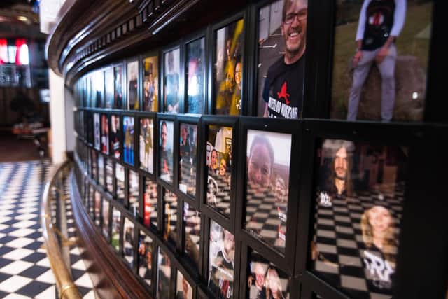 The bar inside Waterloo Music Bar is covered with photos of people who have helped keep them open. Photo: Kelvin Stuttard