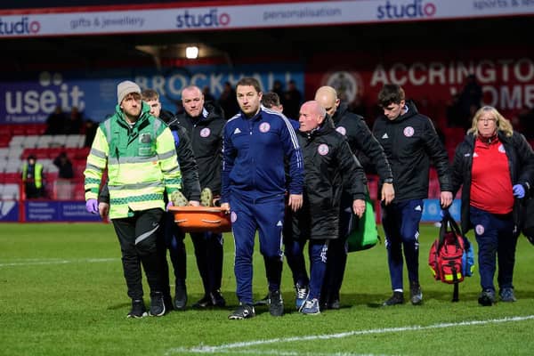 Tharme pictured being carried off on a stretcher on Saturday. Picture: CameraSport
