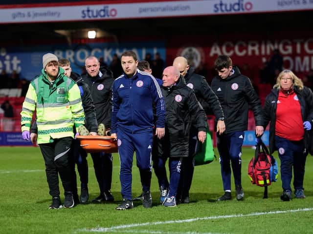 Tharme pictured being carried off on a stretcher on Saturday. Picture: CameraSport
