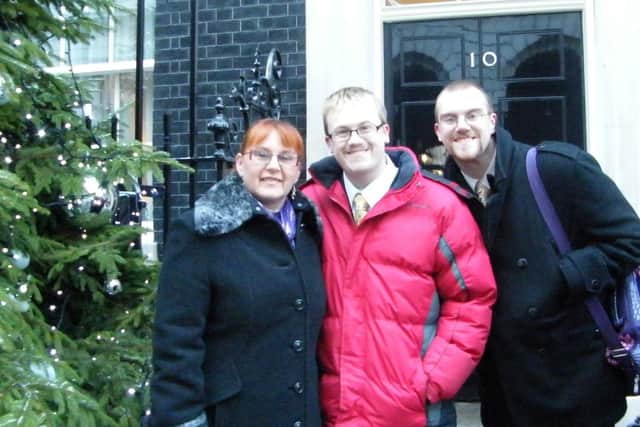 Janet Williams, with her sons outside 10 Downing Street, has been recognised in the Queen's birthday honours list