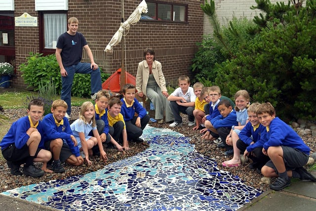 Some of the pupils at St Peters Catholic Primary School, Lytham, who have helped make a "Garden for St Peter" in the school grounds. Also pictured are parent Cath Powell, (who landscaped the garden) and Joseph Thompson (from the artlounge, Lytham) whose mother Nicola worked on the mosaic