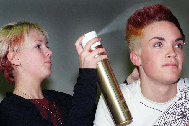 Danielle Follin puts the finishing touches to Kieran Jones' hair at Hair 2000 at Blackpool Winter Gardens