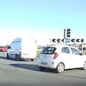The driver narrowly avoided colliding with other cars after going the wrong way around Norcross roundabout before continuing to drive towards oncoming traffic on Amounderness Way in Thornton. (Video by Brian Sillett)
