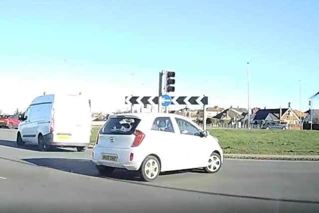 The driver narrowly avoided colliding with other cars after going the wrong way around Norcross roundabout before continuing to drive towards oncoming traffic on Amounderness Way in Thornton. (Video by Brian Sillett)