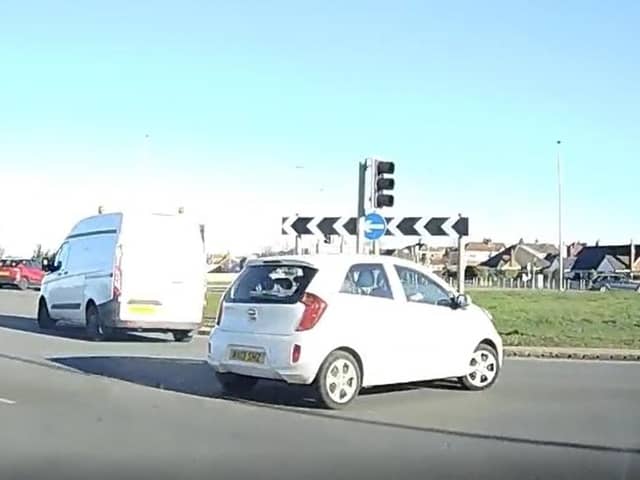 The driver narrowly avoided colliding with other cars after going the wrong way around Norcross roundabout before continuing to drive towards oncoming traffic on Amounderness Way in Thornton. (Video by Brian Sillett)