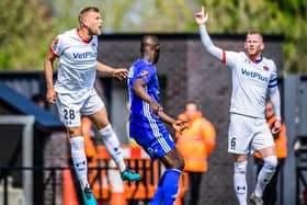 AFC Fylde's Harry Davis in aerial action during Sunday's loss to Boston United Picture: Steve McLellan