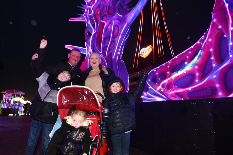 Ian Amess and Riah Glithero with Jenson, nine, Nancy, three, and Oliver, two on Blackpool's Comedy Carpet for the Carpet family party on New Year's Eve