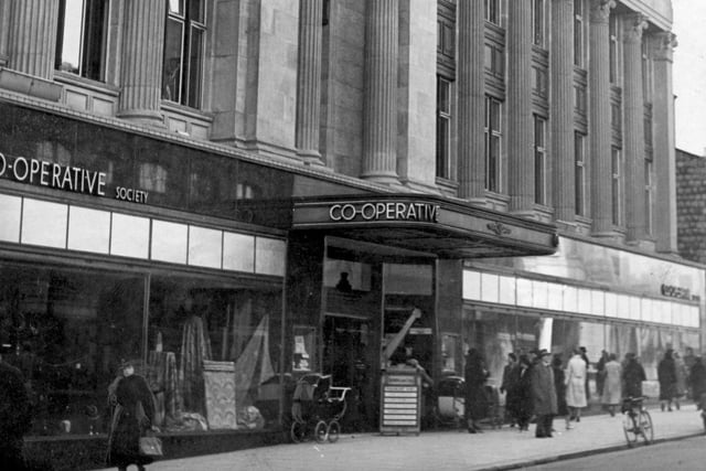 The Co-operative Emporium 's impressive facade. It was located between Sheppard Street which is now gone and Coronation Street