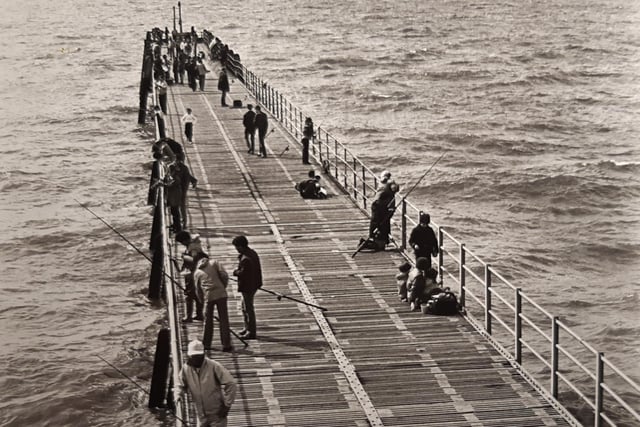 Anglers fishing from the jetty in August 1981