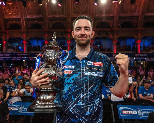 Luke Humphries celebrates after lifting the title (photo: Mark Robinson/PDC)