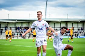 Nick Haughton, celebrates with Siyabonga Ligendza  after opening the score. Photos: Steve Mclellan