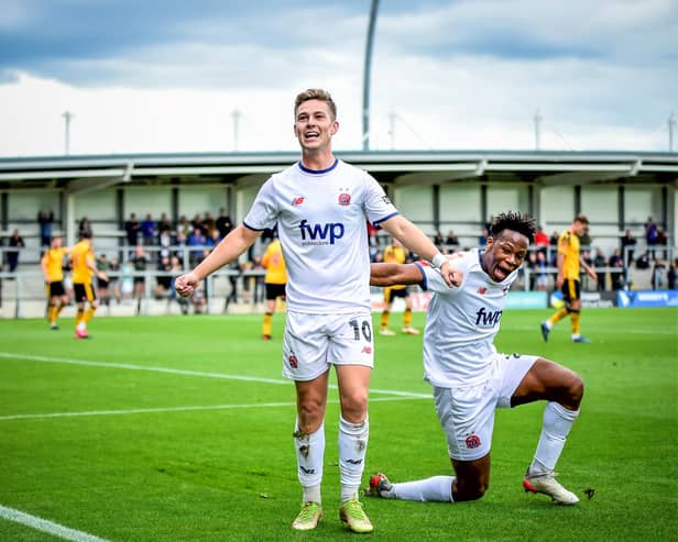 Nick Haughton, celebrates with Siyabonga Ligendza  after opening the score. Photos: Steve Mclellan