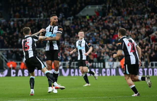 Jamaal Lascelles, Kieran Trippier and Ryan Fraser celebrate their side's first goal against Everton at St. James Park (Photo by Alex Livesey/Getty Images)