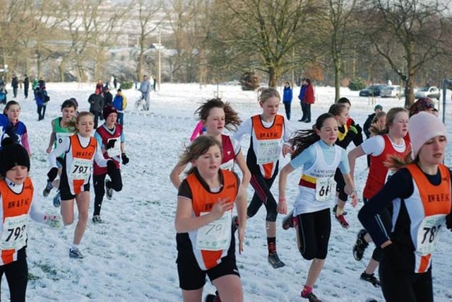 Runners in the under 13 race setting off in a snow covered Towneley Park during a run held by Blackpool Wyre and Fylde Athletics