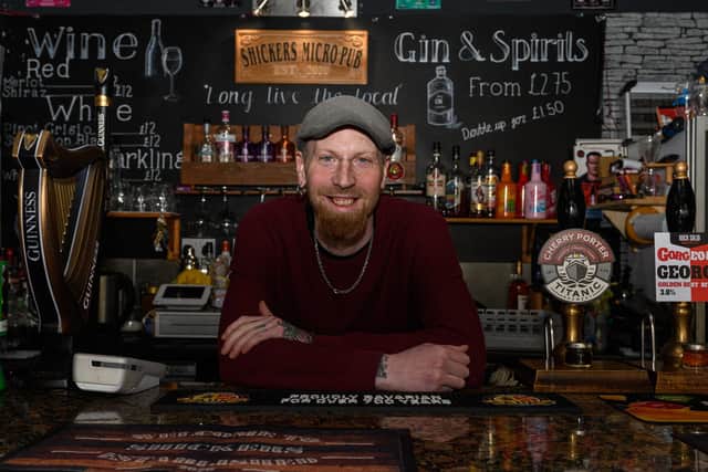 Co-owner of Shickers Liam Johnston behind the bar at Shickers in Blackpool. Photo: Kelvin Stuttard