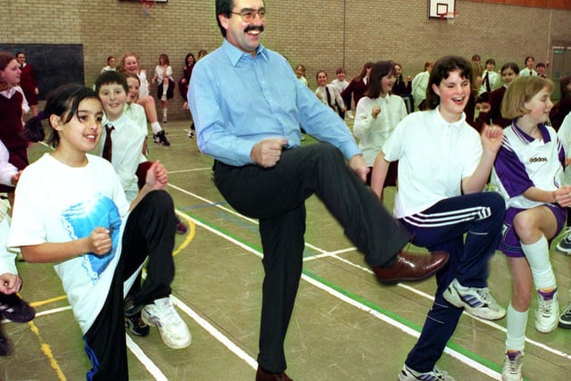 Sponsored aerobics in the sports hall, 1998. Headteacher Paul Moss shows the kids how it's done