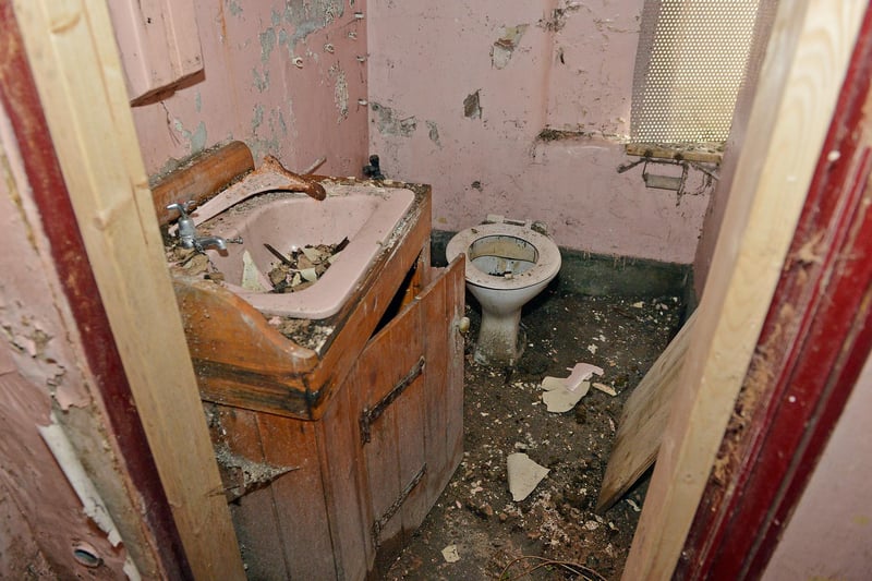 A derelict toilet inside the building.