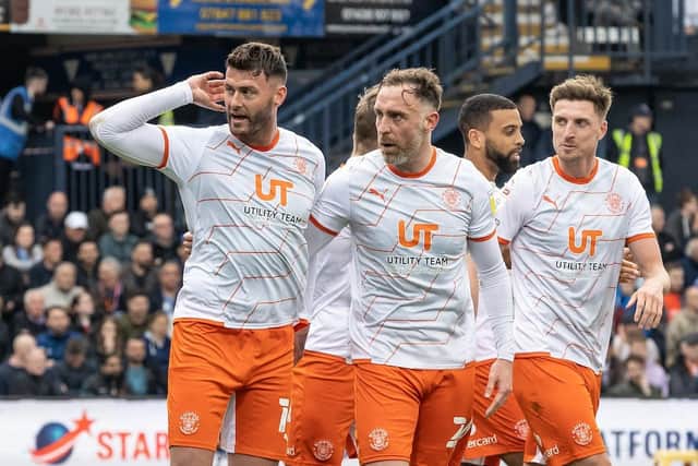 Gary Madine signals to the Luton fans after levelling the scores from the spot