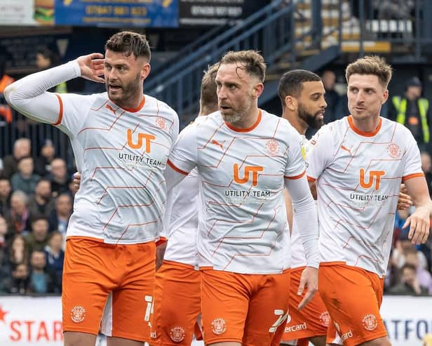 Gary Madine signals to the Luton fans after levelling the scores from the spot