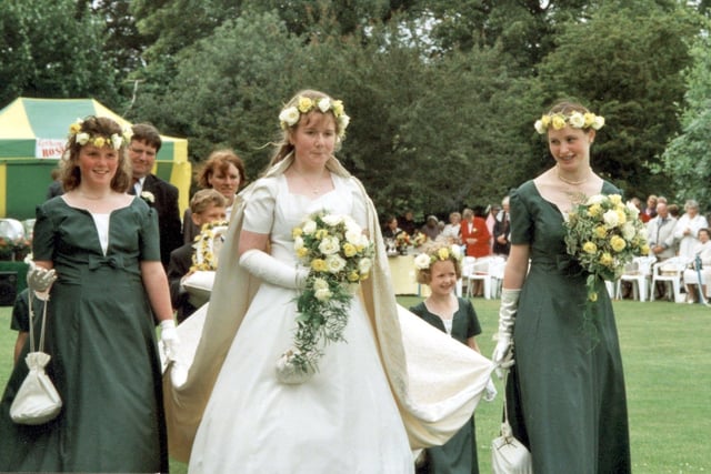 Lesley Rowlings (centre) and her retinue walk through Lowther Gardens during the crowning ceremony for Lytham rose queen, 2000