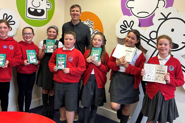 Pupils at Our Lady of the Assumption Catholic Primary School in Blackpool with their copies of Jeff Kinney's Diary of a Wimpy Kid