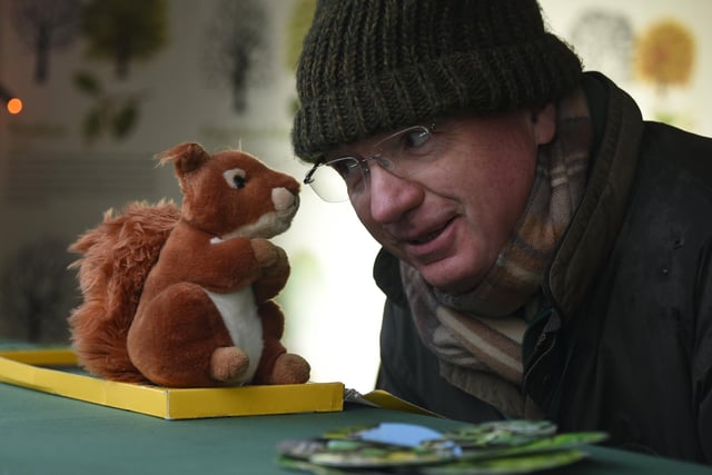 Nigel Corbett, of the Woodland Trust, whispering some Christmas secrets