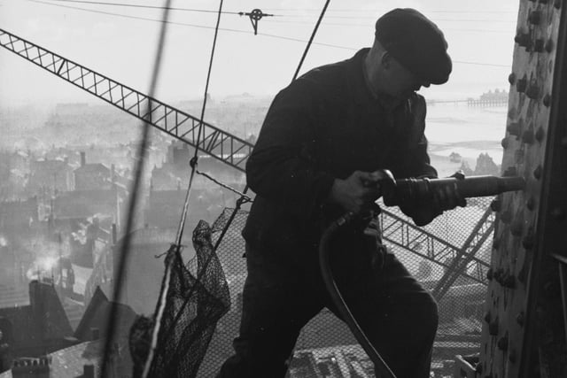 23rd February 1937:  A riveter carrying out repairs to the Blackpool Tower in preparation for the coming holiday season