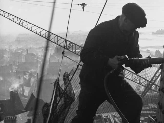 23rd February 1937:  A riveter carrying out repairs to the Blackpool Tower in preparation for the coming holiday season