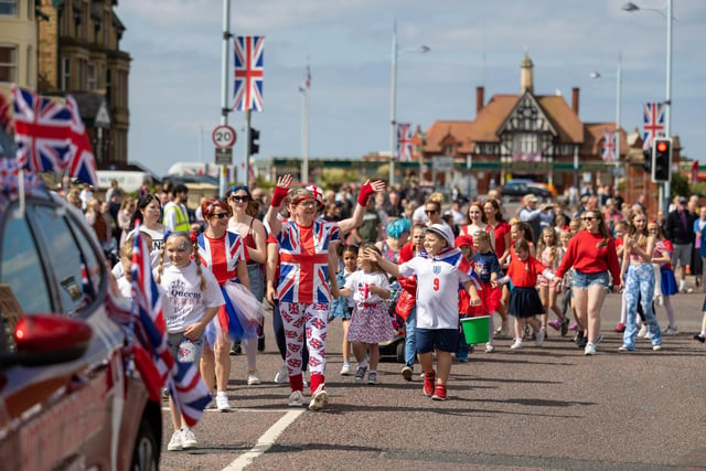 Plenty of red white and blue in the procession.