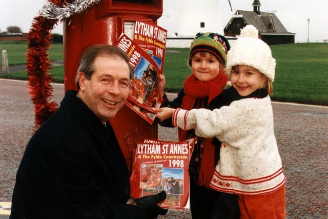 Pictured posting the new 1998 Lytham St. Annes and the Fylde Countryside holiday guide are left to right: Councillor John Longstaff, chairman of tourism and leisure, Lucy Norris, aged five, and Sophie Owen, aged six